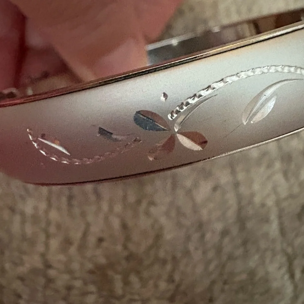 GUC silver tone bangle with safety chain